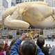 Once again this year, dozens of happy children slipped and skidded across the ceremonial turkey fat on the ice rink.